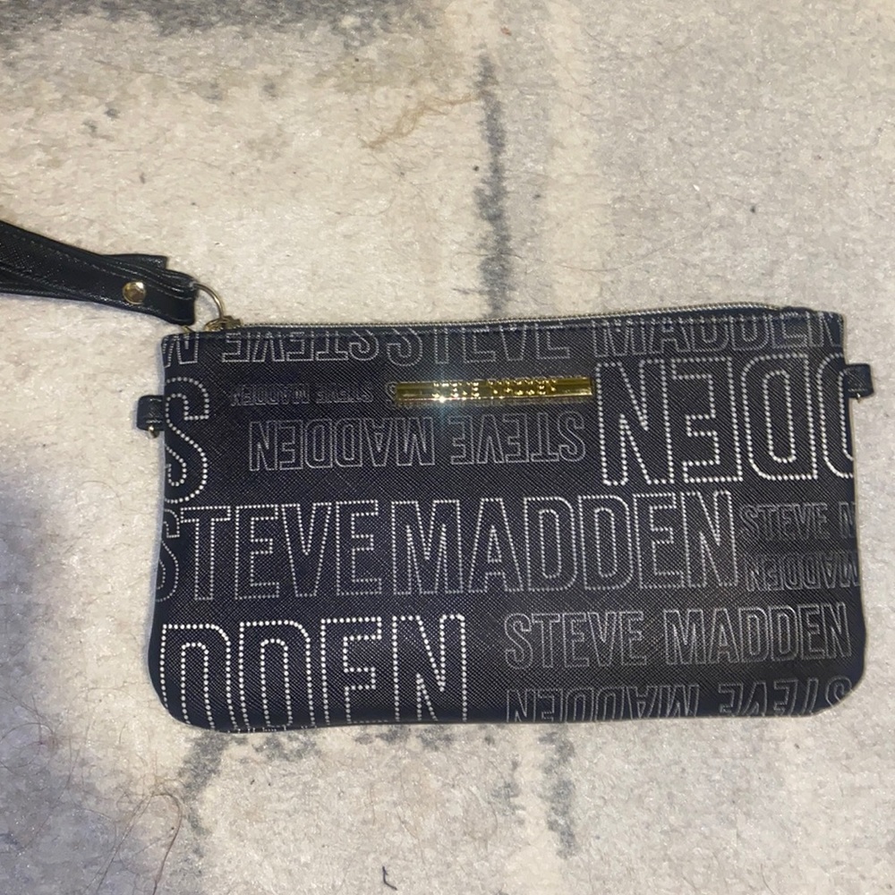 Steve Madden, never used, attached phone charger and usb